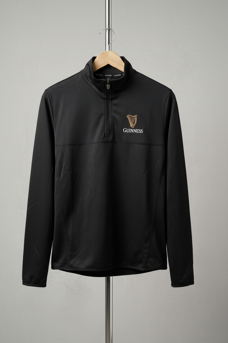 Black pullover with Guinness logo on a gray background