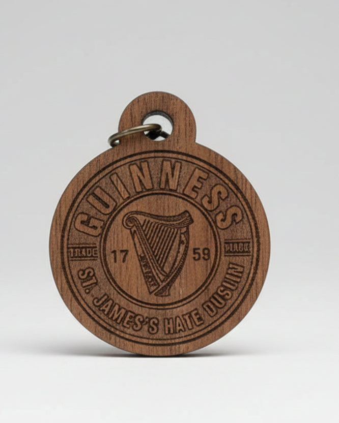 Wooden keyring with engraved design on a clear background