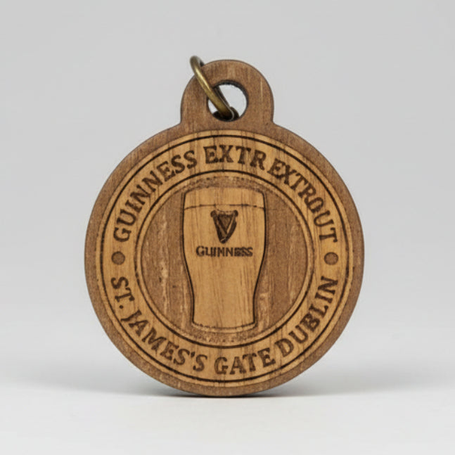 Guinness keyring with brand logo on a clear background