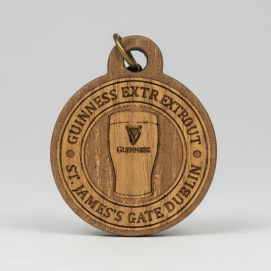 Guinness keyring with brand logo on a clear background